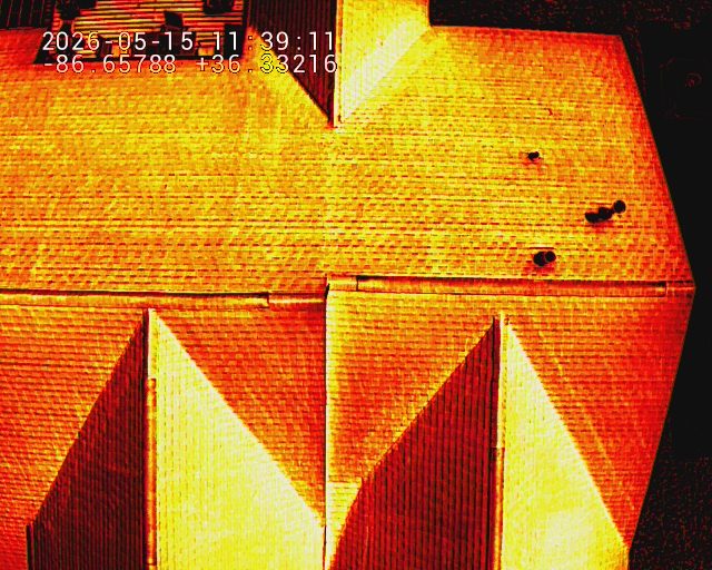 Thermal drone image of the same residential roof showing surface temperature variation